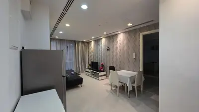 a living room with a white table and chairs at KLCC Bukit Bintang Binjai 8 premium soho by Prime Suites in Kuala Lumpur