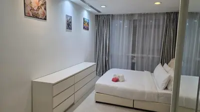 a white room with a bed and a window at KLCC Bukit Bintang Binjai 8 premium soho by Prime Suites in Kuala Lumpur
