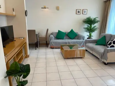 a living room with two couches and a tv at Kuala Lumpur city centre in Kuala Lumpur