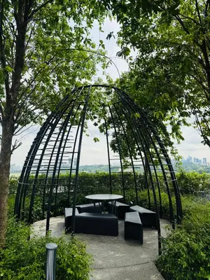 a metal circle with a table and chairs in a park at Trion Residence Kuala Lumpur By A&B in Kuala Lumpur