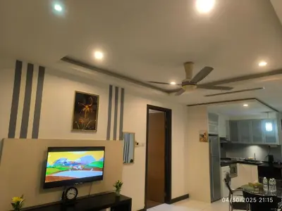 a living room with a ceiling fan and a tv at 0108 Casa Residency- Sweet Home 2R 2B in Kuala Lumpur