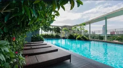 a large swimming pool with benches in a building at 0108 Casa Residency- Sweet Home 2R 2B in Kuala Lumpur