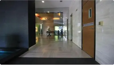 a hallway of a building with people walking down it at 0108 Casa Residency- Sweet Home 2R 2B in Kuala Lumpur