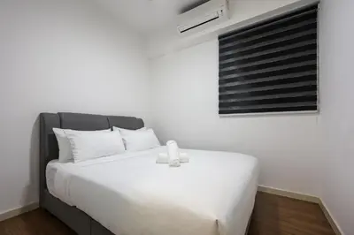 a white bed with a white teddy bear sitting on it at M Vertica Residences by The Clover, Maluri , Cheras , Kuala Lumpur , KLCC, Free Parking in Kuala Lumpur