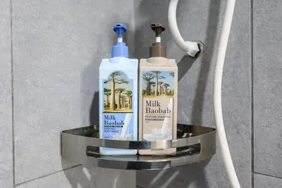 two bottles of hair products on a shelf in a bathroom at M Vertica Residences by The Clover, Maluri , Cheras , Kuala Lumpur , KLCC, Free Parking in Kuala Lumpur