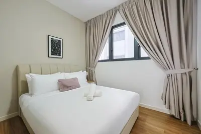 a bedroom with a large white bed with a window at M Vertica Residences by The Clover, Maluri , Cheras , Kuala Lumpur , KLCC, Free Parking in Kuala Lumpur
