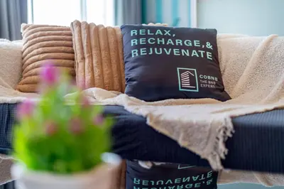 a couch with a pillow on top of it at Platinum near KLCC Kuala Lumpur in Kuala Lumpur