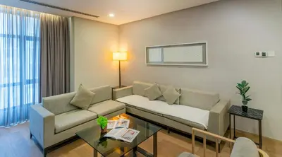 a living room with a couch and a table at 188 Suites near KLCC with Parking and Bathtub in Kuala Lumpur