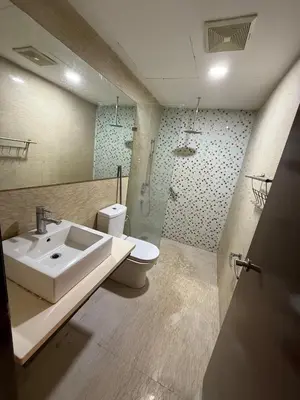 a bathroom with a sink and a toilet at Infinity Sky Pool, Regalia Suite KLCC in Kuala Lumpur