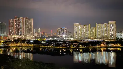 a city skyline at night with a river and buildings at Setapak Central Mall in Kuala Lumpur