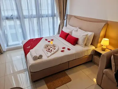 a bedroom with a bed with a valentines blanket and a heart at Majestic Residence KLCC By AMG in Kuala Lumpur
