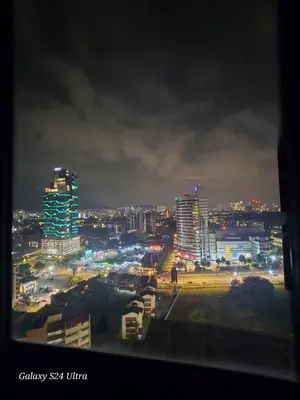 a view of a city at night with buildings at Neu Suite 2 Rooms 1 Bath Unit For Rent Free Wi-Fi Deposit RM200 in Kuala Lumpur