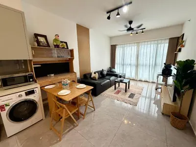 a kitchen and living room with a couch and a table at Agile bukit bintang TRX by KLCC in Kuala Lumpur