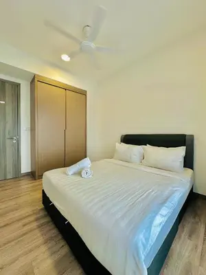 a bedroom with a large bed with white sheets at Agile bukit bintang TRX by KLCC in Kuala Lumpur
