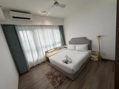 a bedroom with a white bed with a cross on it at Agile bukit bintang TRX by KLCC in Kuala Lumpur