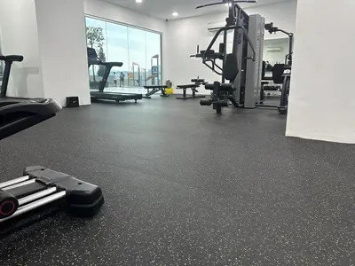 a gym with a treadmill and treadles on the floor at K&L Suites Razak City Kuala Lumpur in Kuala Lumpur