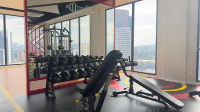 a gym with a view of a city at Luxury studio 2607B for couple Majestic Residence KLCC in Kuala Lumpur