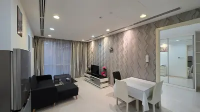 a living room with a couch and a table at KLCC Binjai 8 Premium Soho Apartment by prime suites in Kuala Lumpur
