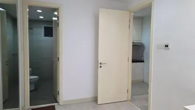 a bathroom with two glass doors and a toilet at KLCC Binjai 8 Premium Soho Apartment by prime suites in Kuala Lumpur