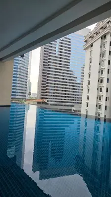 a swimming pool in a building with tall buildings at KLCC Binjai 8 Premium Soho Apartment by prime suites in Kuala Lumpur