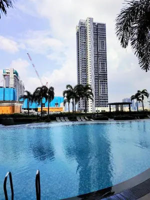 a large swimming pool in front of a tall building at Trion Residence Kuala Lumpur by Centrix in Kuala Lumpur