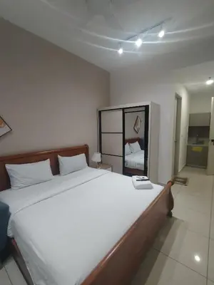 a bedroom with a large bed with a phone on it at Trion Residence Kuala Lumpur by Centrix in Kuala Lumpur