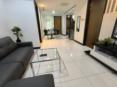 a living room with a couch and a glass table at 013A2 Casa Residency- Sweet Home 2R 2B in Kuala Lumpur