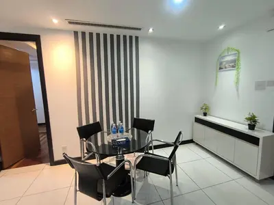 a dining room with a glass table and black chairs at 013A2 Casa Residency- Sweet Home 2R 2B in Kuala Lumpur
