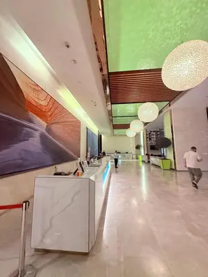 a lobby of a building with people walking in it at Platinum Suites Kuala Lumpur BY NOVA in Kuala Lumpur