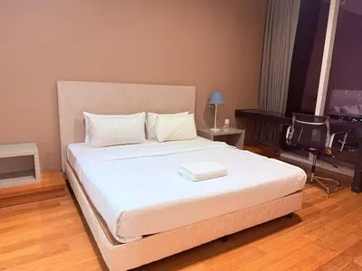 a bedroom with a large white bed in a room at Platinum Suites Kuala Lumpur BY NOVA in Kuala Lumpur