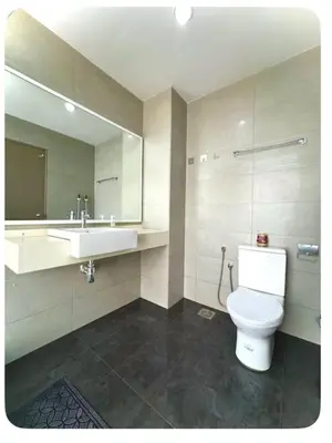 a bathroom with a toilet and a sink and a mirror at Setapak Central Mall Bathtub & Netflix in Kuala Lumpur