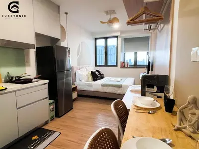 a small apartment with a kitchen and a dining table at Riveria city in Kuala Lumpur