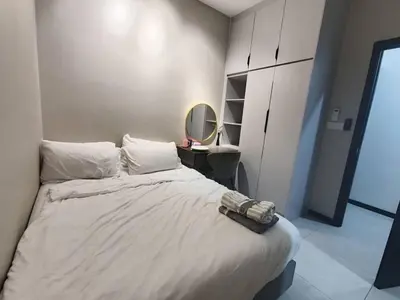 a bedroom with a large bed with a mirror at Mini studio with own private bathroom, free Wi-Fi in Kuala Lumpur