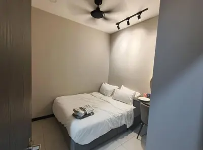 a small bedroom with a bed and a ceiling fan at Mini studio with own private bathroom, free Wi-Fi in Kuala Lumpur