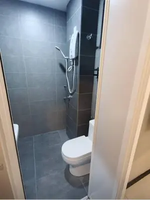 a bathroom with a toilet and a shower at Mini studio with own private bathroom, free Wi-Fi in Kuala Lumpur