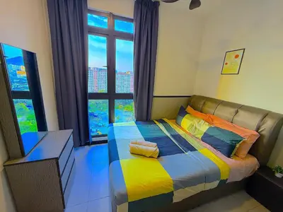 a bedroom with a colorful bed with a large window at Neu suite, Family Unit - Jelatek LRT Gleneagles Hospital in Kuala Lumpur