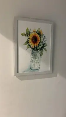 a picture of a vase with a flower in it at Butterfly Home in Kuala Lumpur