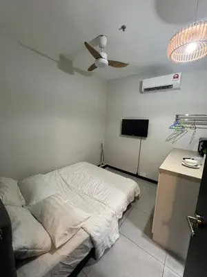 a bedroom with a bed and a ceiling fan at Neu Suite small studio with own private bathroom free wifi Deposit RM200 in Kuala Lumpur