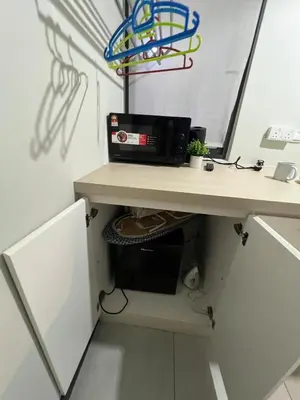 an office with a desk with a computer on it at Neu Suite small studio with own private bathroom free wifi Deposit RM200 in Kuala Lumpur