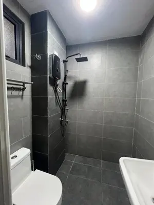 a bathroom with a shower and a toilet and a sink at Neu Suite small studio with own private bathroom free wifi Deposit RM200 in Kuala Lumpur