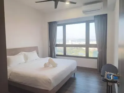 a bedroom with a bed and a large window at Sky Line Agile Suites KL in Kuala Lumpur