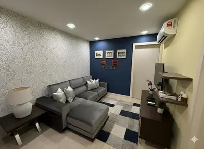 a living room with a couch and a table at Luxury Fairlane Residence Suites Kuala Lumpur by AZI BNB in Kuala Lumpur