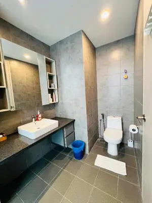 a bathroom with a sink and a toilet at FA Suits KL BY ROBERTSON in Kuala Lumpur