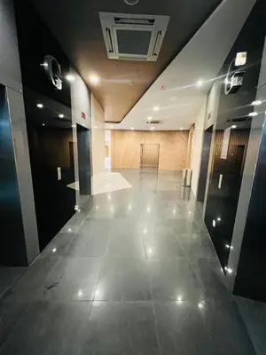 an empty hallway in a large office building at FA Suits KL BY ROBERTSON in Kuala Lumpur