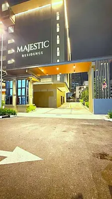 a large building with a sign on the front of it at Majestic Residence Suites KLCC in Kuala Lumpur