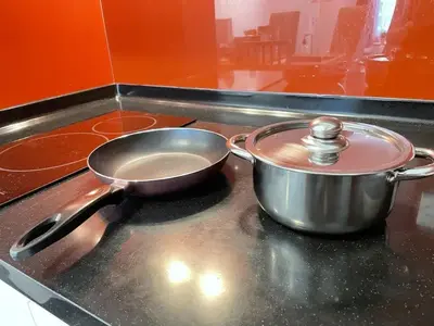a pan on a stove with a pot on it at 1-5 people, Scandinavian Style Arcoris Mont Kiara in Kuala Lumpur