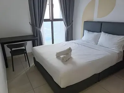 a bedroom with a bed with a white towel on it at Trion Hotel by HAVENZA near TRX, Time Square and Bukit Bintang in Kuala Lumpur