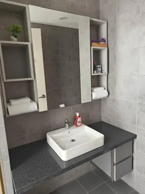 a bathroom with a sink and a mirror at Martin House KL in Kuala Lumpur