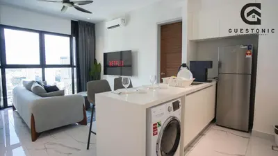 a kitchen and living room with a washer and dryer at Alfa Bangsar by Guestonic in Kuala Lumpur