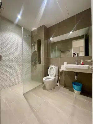 a bathroom with a toilet and a sink and a shower at Quill Residences KLCC By ONZO in Kuala Lumpur
